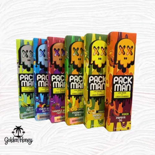 Variety of Packman vape pen boxes in colorful designs, featuring flavors like Lava Melon, and Papaya OG.