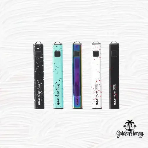 WULF FLAT PLUS batteries in various colors against a textured background, showcasing their sleek design.