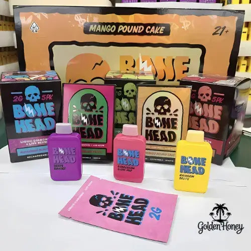 Bone Head Dispositivo Americano with colorful packaging and products, including Mango Pound Cake and Liquid Diamonds.
