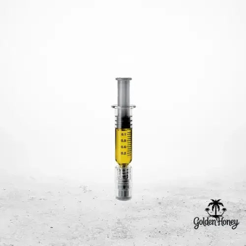 Jeringa que contiene destilado de THC de primera calidad, ideal para rellenar cartuchos y para uso personal.