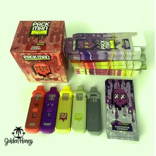 PackMan 2ML vape devices in assorted colors with packaging, showcasing portable vaping technology.