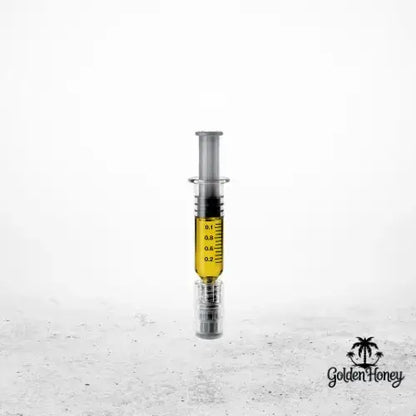 Jeringa que contiene destilado de THC de primera calidad, ideal para rellenar cartuchos y para uso personal.